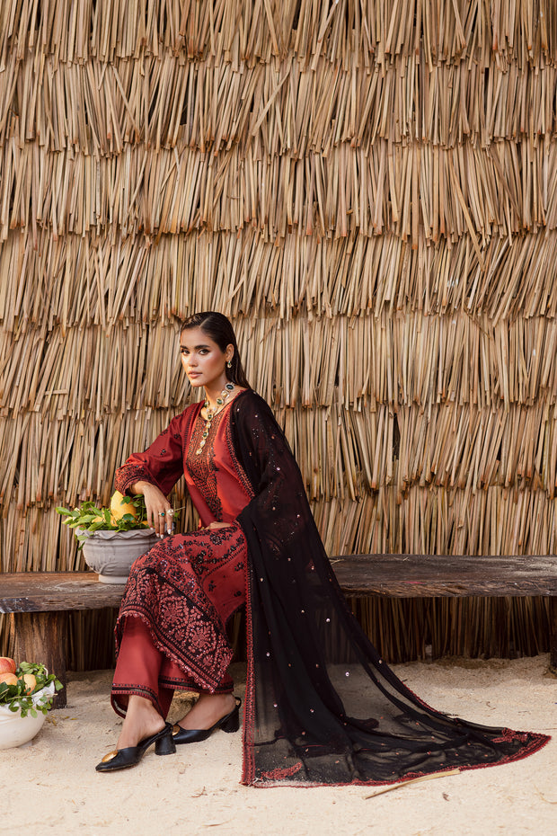 Kavya-finished hem with crystal embellishments and layered embroidery luxury Pakistani khaddar suit for winter collection.