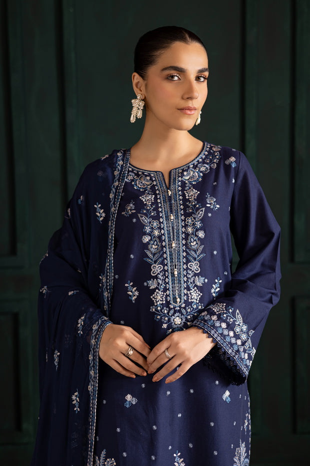 Blue khaddar shirt by Batik adorned with detailed embroidery and crochet lace for an elegant festive look. Affordable ethnic Pakistani South Asian.