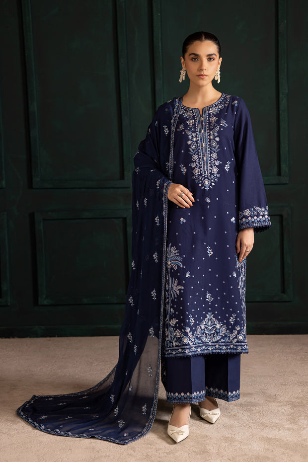 Batik Adoro three piece khaddar set featuring a long blue embroidered shirt with lace finishing and crinkle dupatta. Affordable ethnic Pakistani South Asian