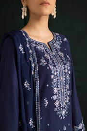Elegant Batik khaddar three piece outfit in blue featuring embroidery and lace finishing. Affordable ethnic Pakistani South Asian
