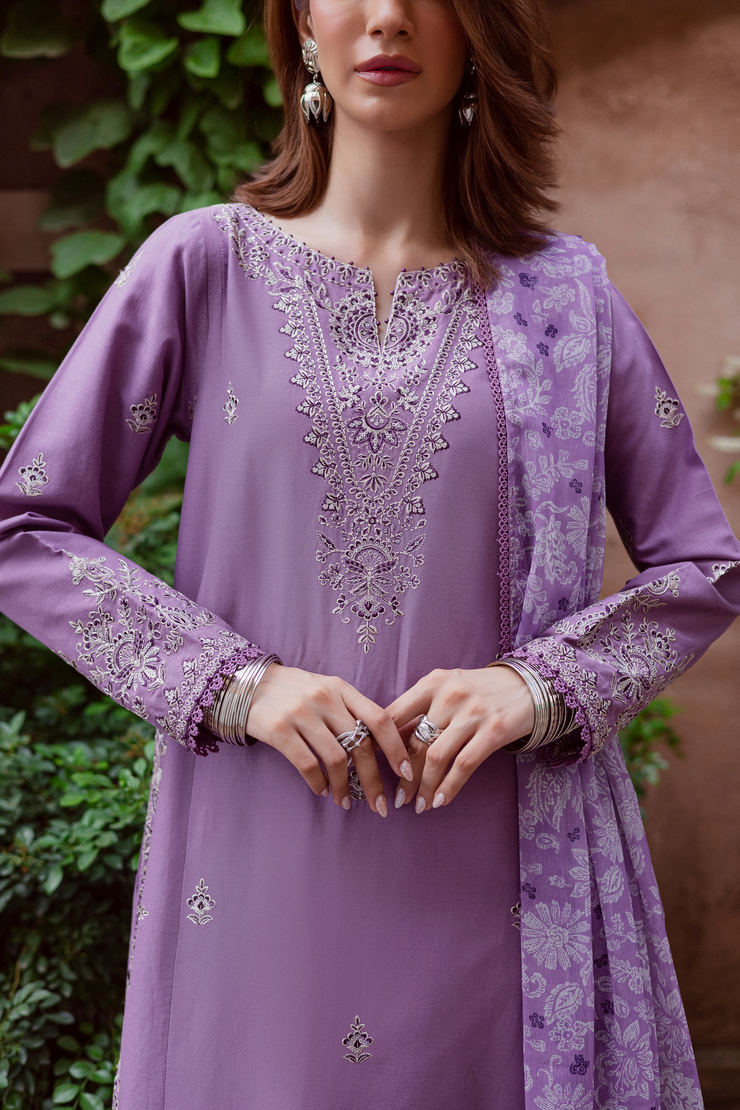 Three piece embroidered khaddar set blending soft lavender tones with refined craftsmanship. Ready to wear Pakistani South Asian.