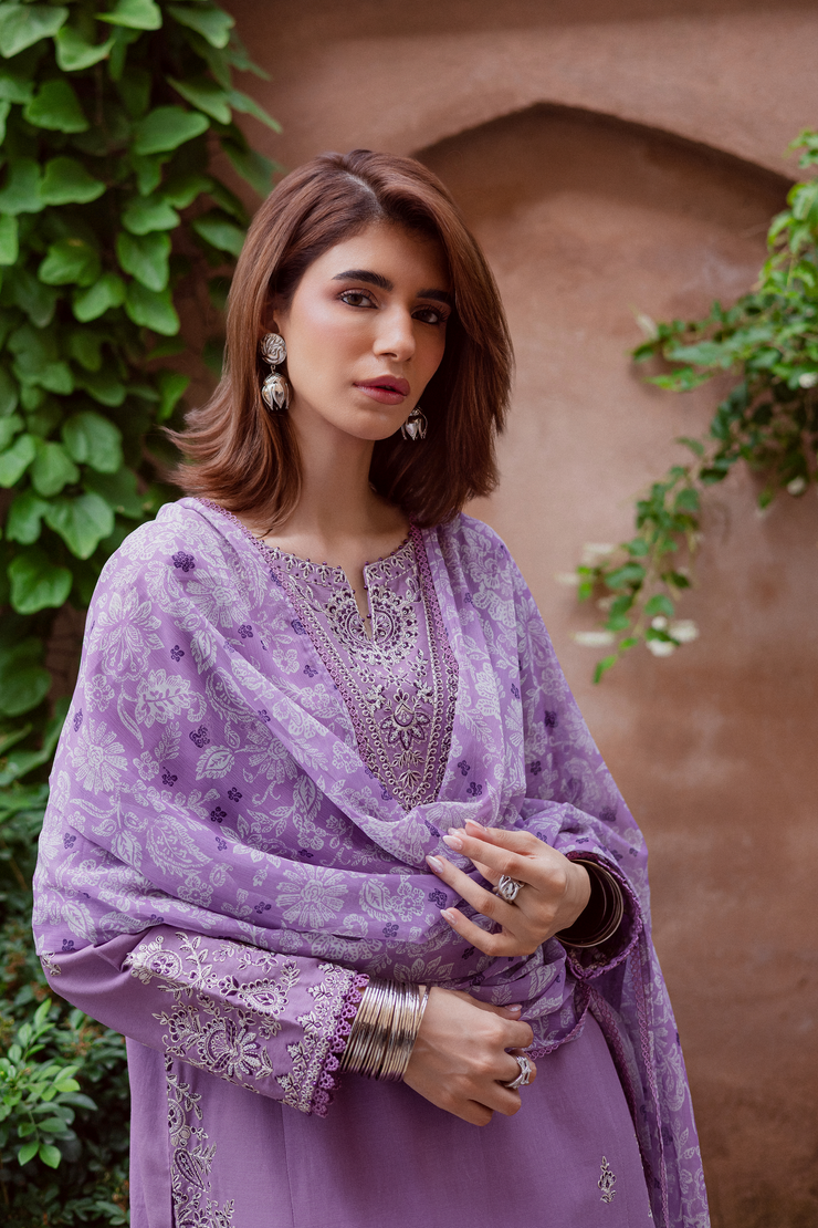 Lavender embroidered khaddar shirt complemented by loose fit contrast trousers with embroidered border. Ready to wear Pakistani South Asian