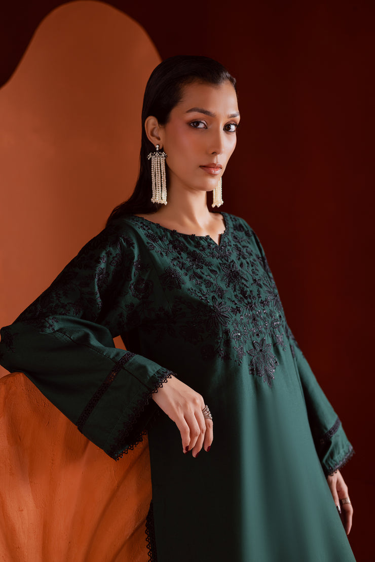 Batik embroidered khaddar outfit in deep emerald tones combining craftsmanship and modern elegance. Affordable ethnic Pakistani South Asian.