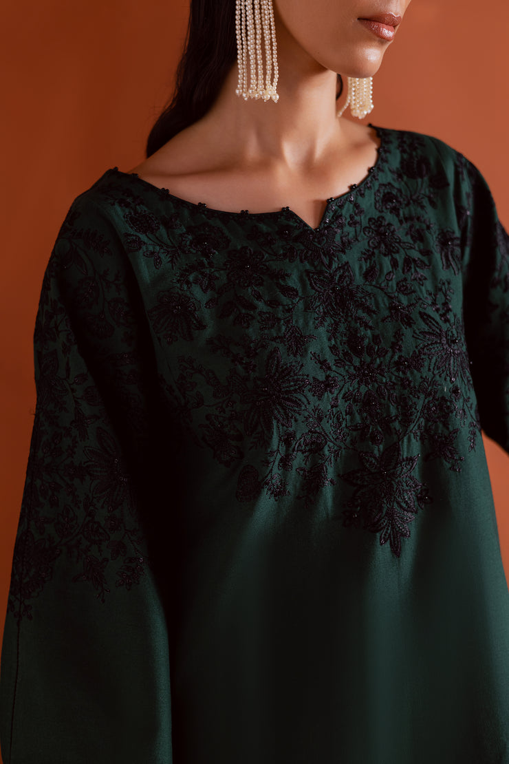 Elegant emerald green two piece khaddar outfit by Batik blending tradition with modern refinement. Affordable ethnic Pakistani South Asian.