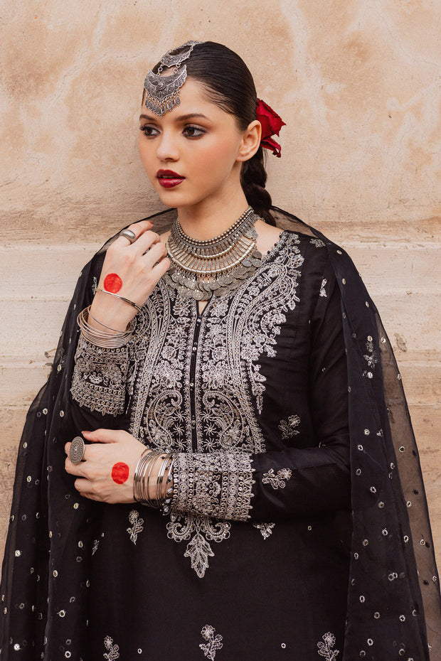 Embroidered black raw silk outfit combining refined craftsmanship with elegant festive detailing. Festive luxury Pakistani South Asian.