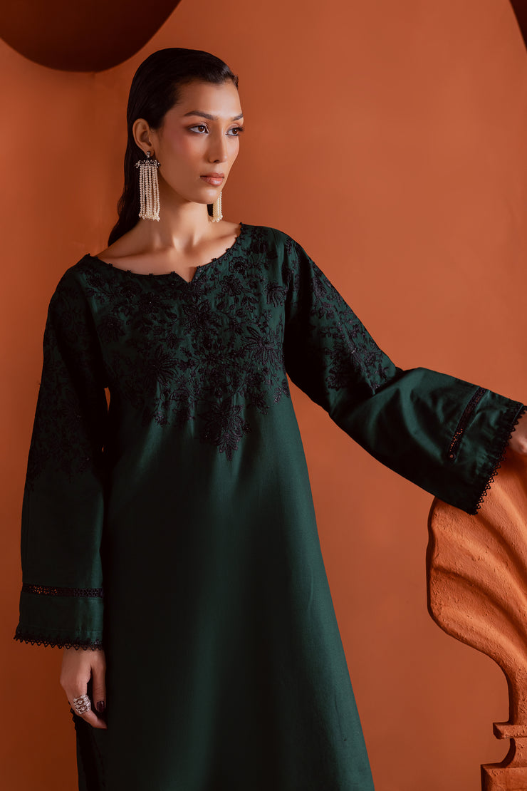 Emerald green khaddar shirt by Batik detailed with contrast black embroidery and refined neckline design.