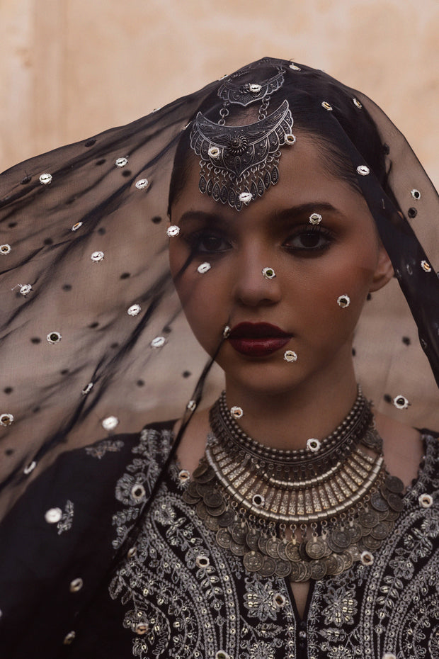 Black festive outfit featuring crystal embellished neckline and intricately detailed sharara. Festive luxury Pakistani South Asian