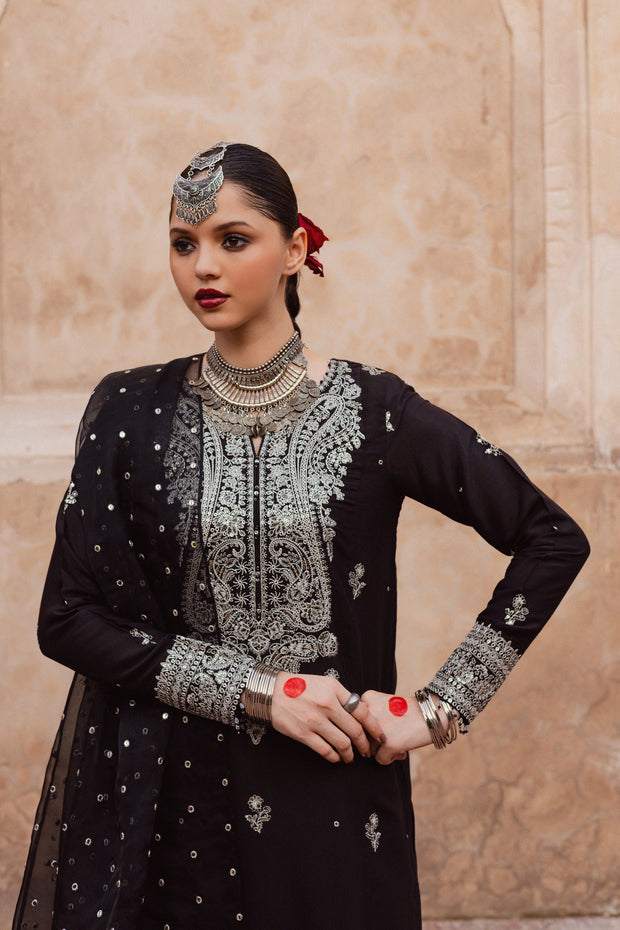 Black raw silk shirt with delicate embroidery and crystal work paired with embroidered sharara. Festive luxury Pakistani South Asian.