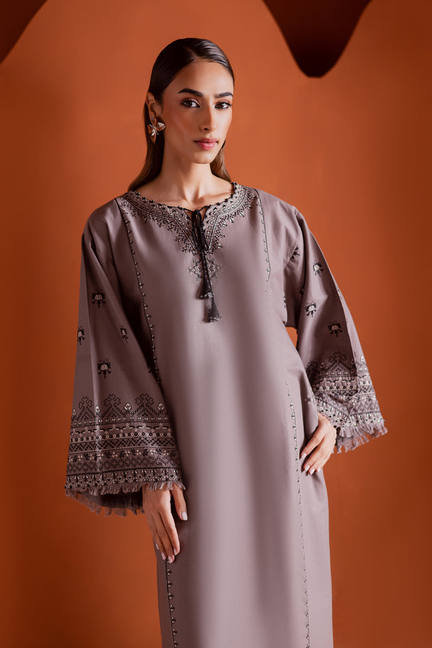 Grey khaddar outfit adorned with cross stitch embroidery and thread tassels at the neckline. Ready to wear Pakistani South Asian.