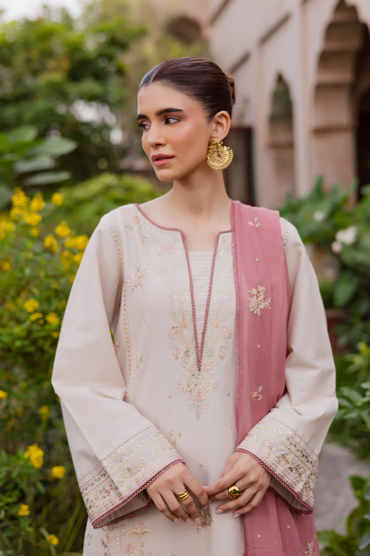 Embroidered khaddar shirt in soft tones adorned with delicate beadwork and refined detailing. Ready to wear Pakistani South Asian.