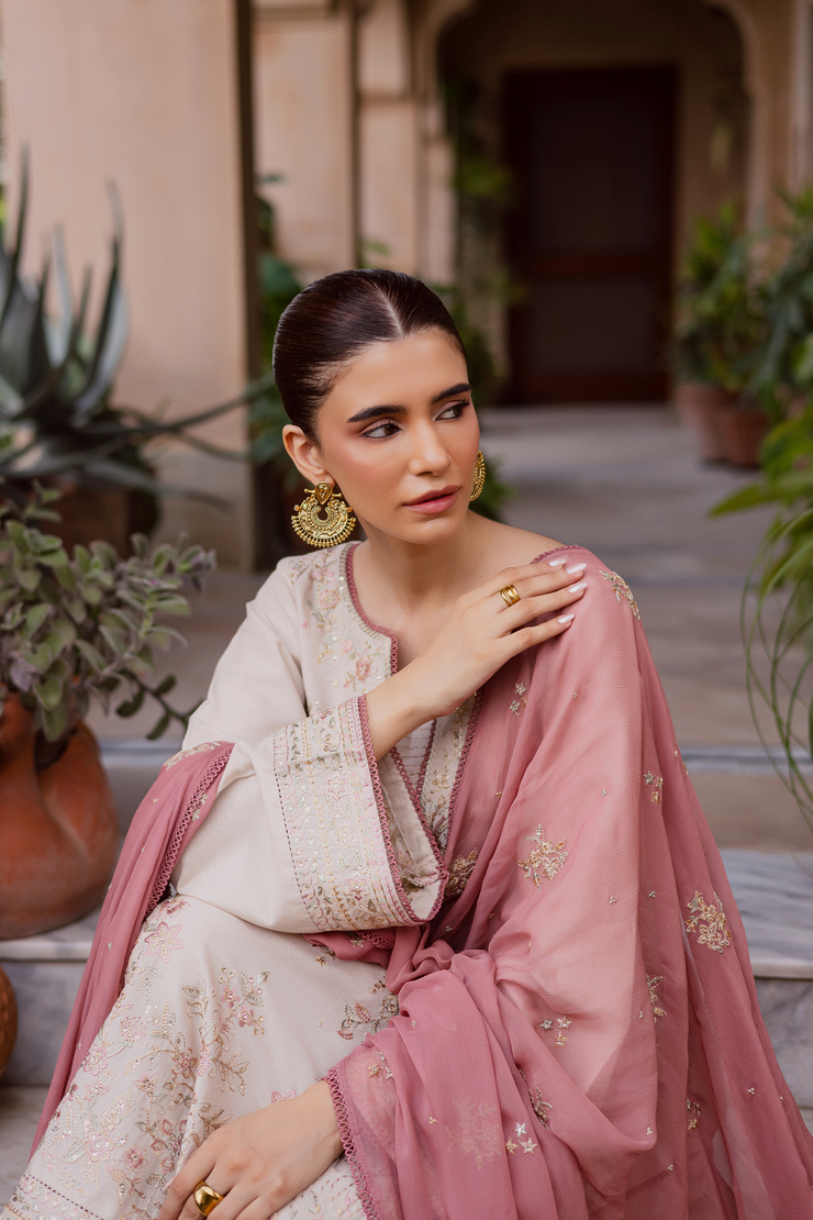 Embroidered paneled khaddar shirt with bead accents and elegant craftsmanship. Ready to wear Pakistani South Asian.