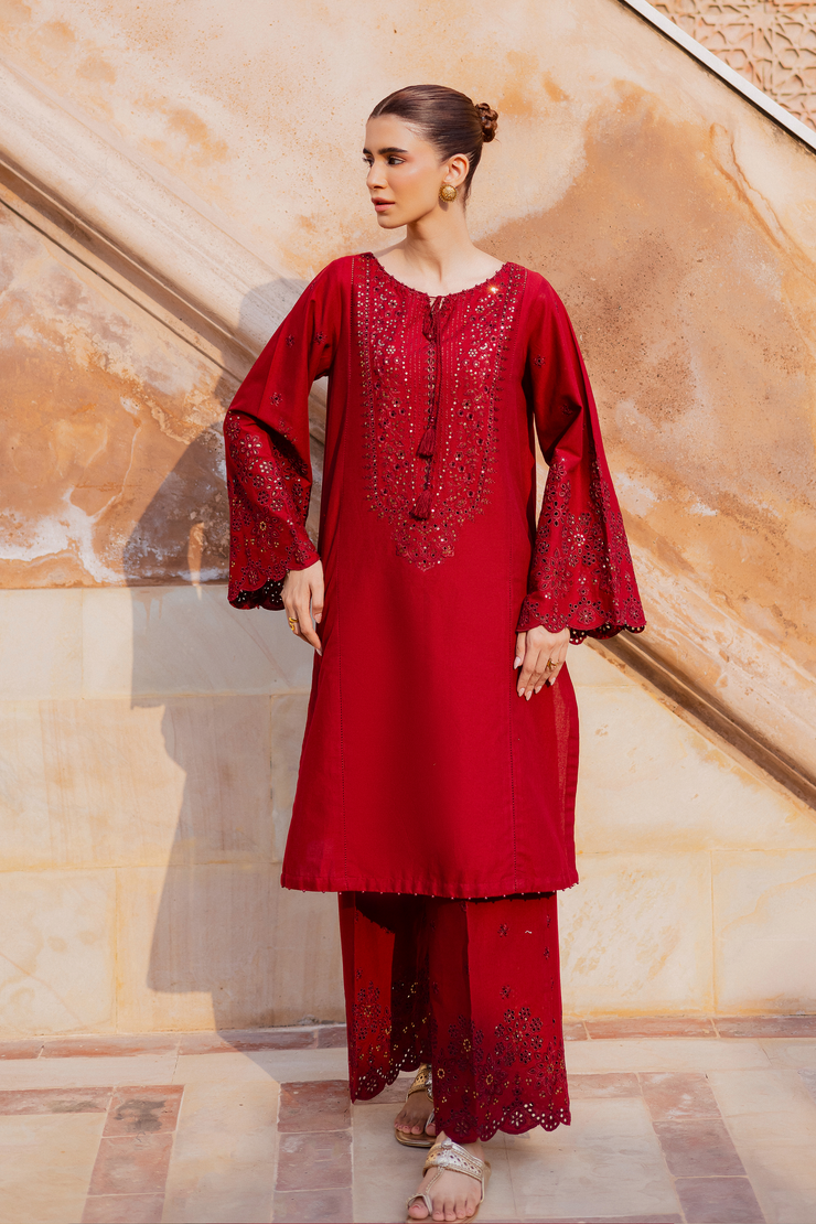 Red khaddar outfit showcasing intricate embroidery and refined craftsmanship for a luxurious look. Ready to wear Pakistani South Asian.