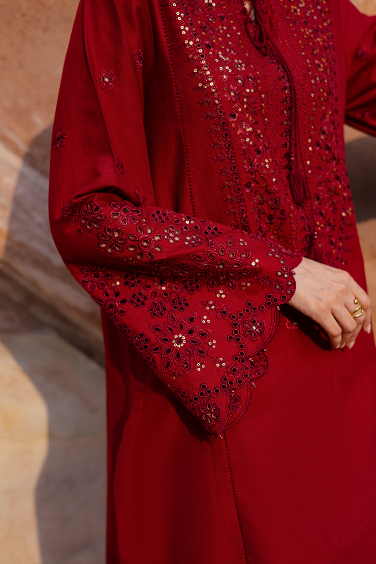 Red embroidered khaddar set combining timeless charm with delicate handwork details. Ready to wear Pakistani South Asian.