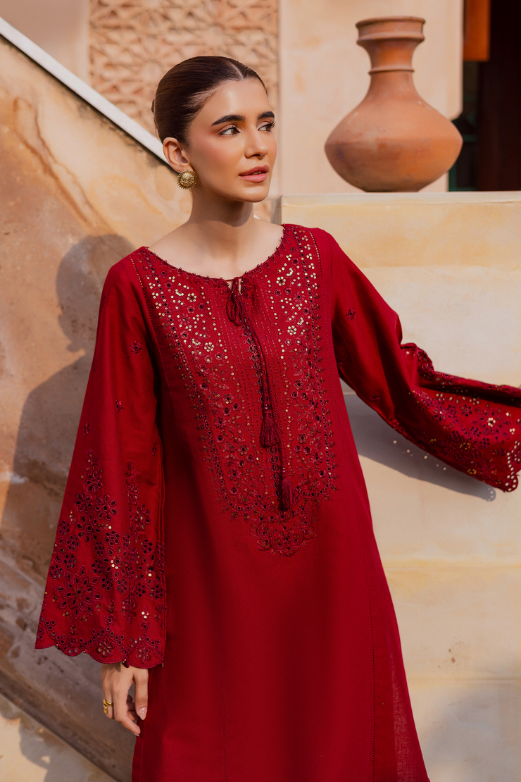 Two piece embroidered khaddar ensemble in deep red with detailed neckline and sleeve borders. Ready to wear Pakistani South Asian.