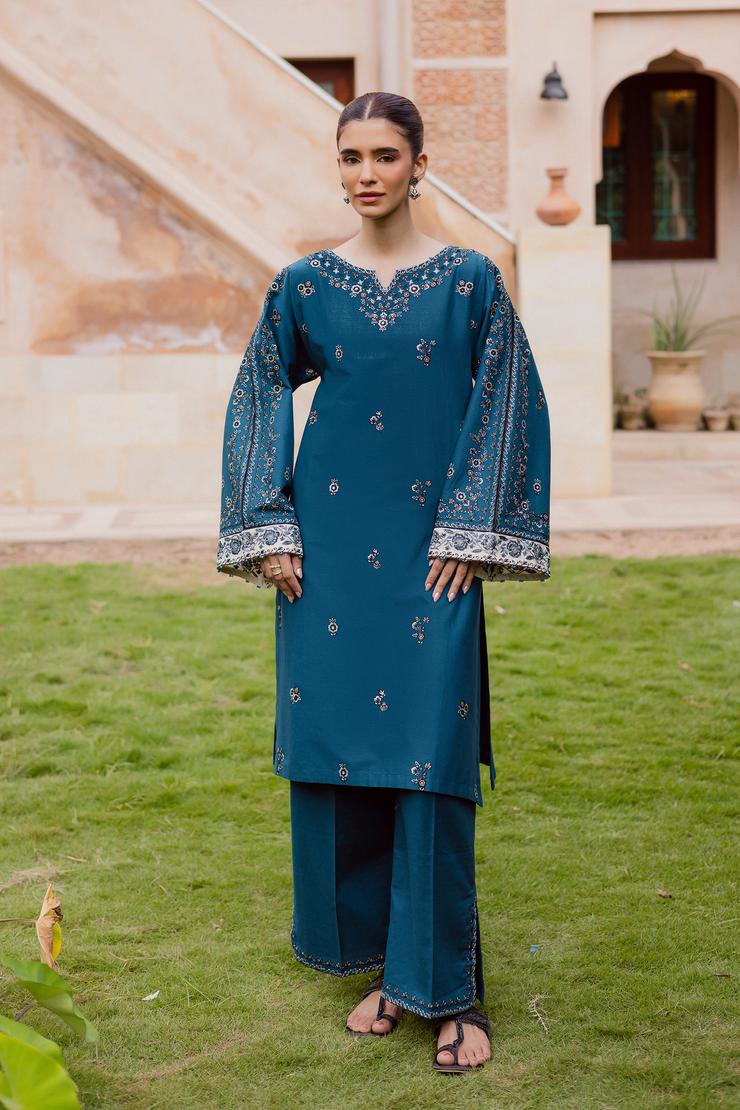 Embroidered khaddar shirt paired with matching culottes designed with slit hem embroidery. Ready to wear Pakistani South Asian.