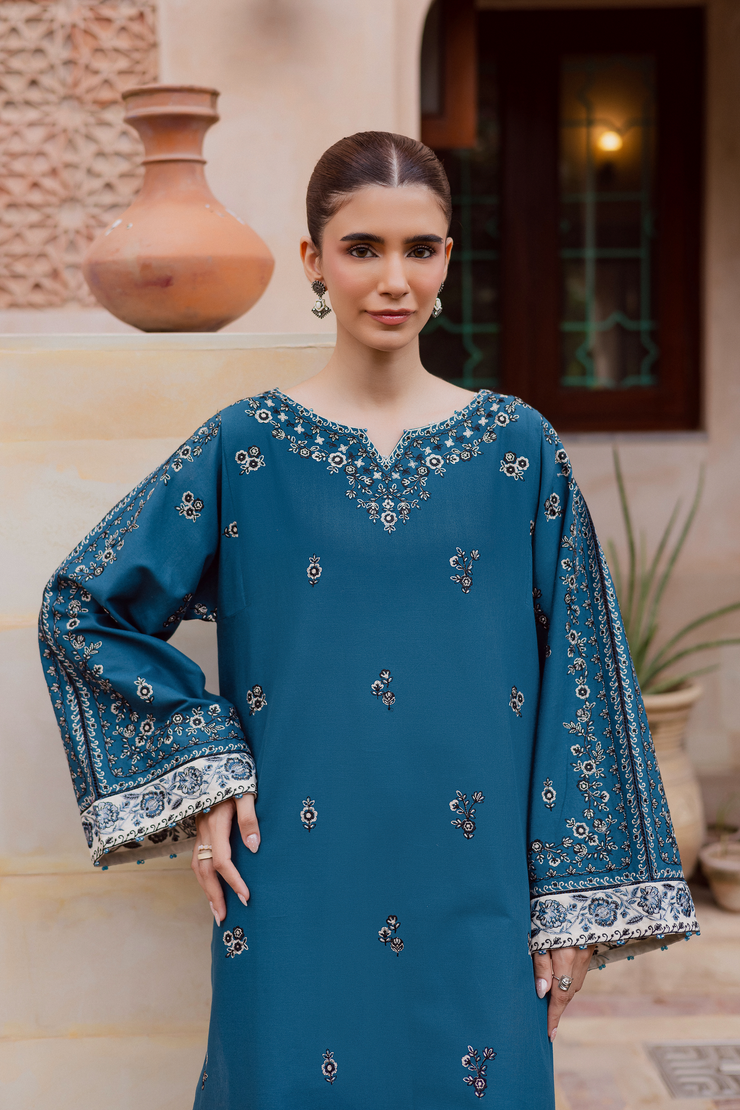 Embroidered blue khaddar shirt with contrasting sleeve borders and delicate embellishments. Ready to wear Pakistani South Asian.