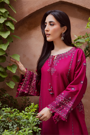 Two piece Batik khaddar ensemble with cross stitch embroidery and delicate lace finishing. Affordable ethnic Pakistani South Asian.