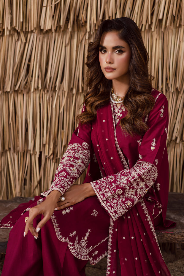 Heavily embroidered sleeve with intricate threadwork on burgundy khaddar fabric traditional Pakistani outfit Batik UK