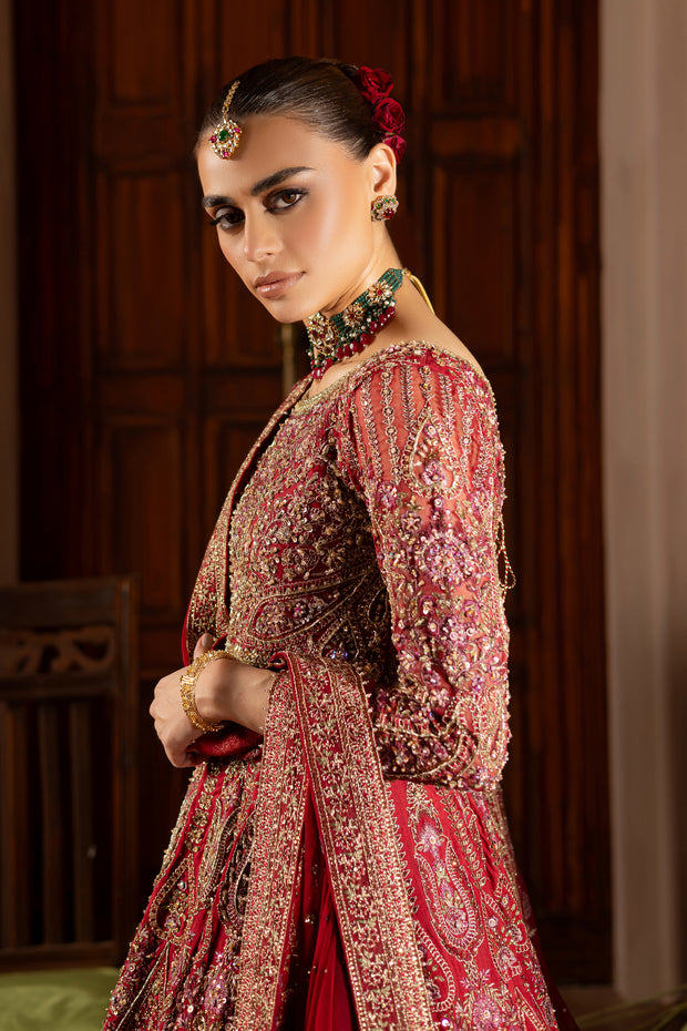 red gold embroidery Side angle capturing Azrina’s detailed dupatta borders and matching pearl-embellished pouch. Bridal luxury Pakistani South Asian India desi