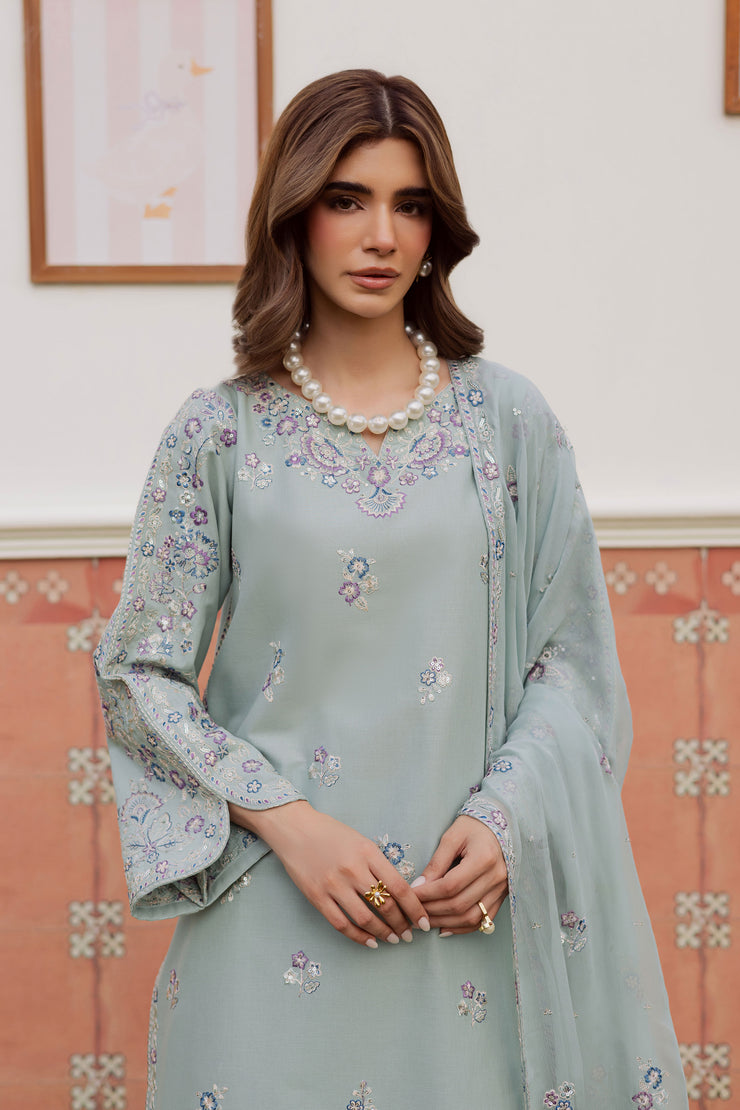 A warm winter South Asian outfit in soft khaddar, designed for Pakistani and Indian festive events, weddings, Eid gatherings and elegant everyday wear.