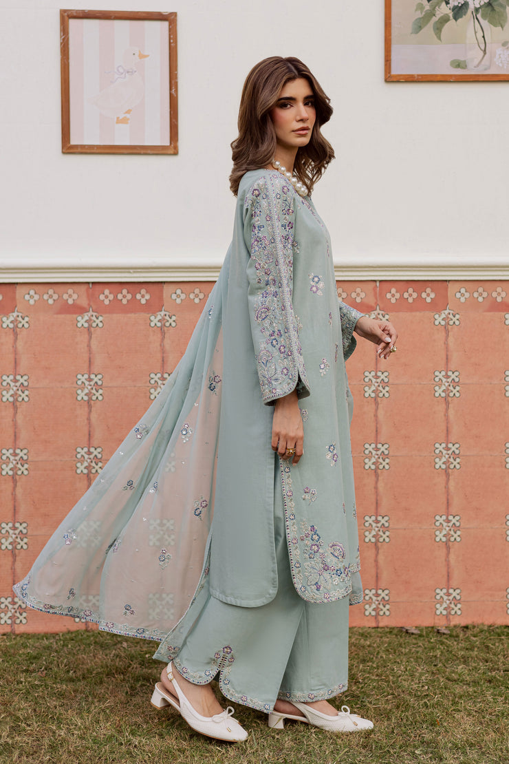 A warm winter South Asian outfit in soft khaddar, designed for Pakistani and Indian festive events, weddings, Eid gatherings and elegant everyday wear.