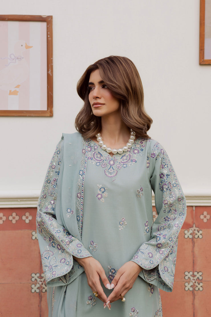 A warm winter South Asian outfit in soft khaddar, designed for Pakistani and Indian festive events, weddings, Eid gatherings and elegant everyday wear.