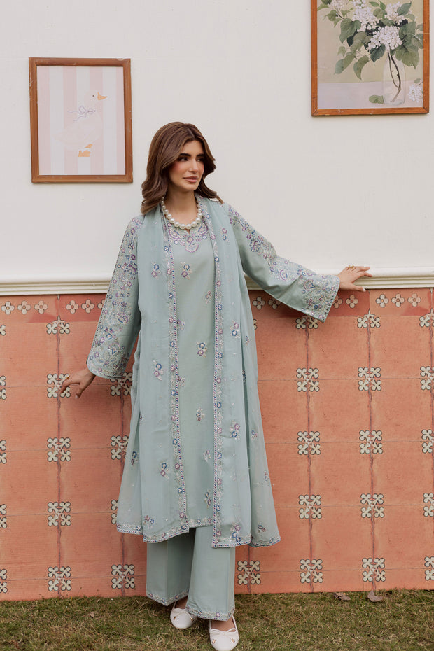 A warm winter South Asian outfit in soft khaddar, designed for Pakistani and Indian festive events, weddings, Eid gatherings and elegant everyday wear.