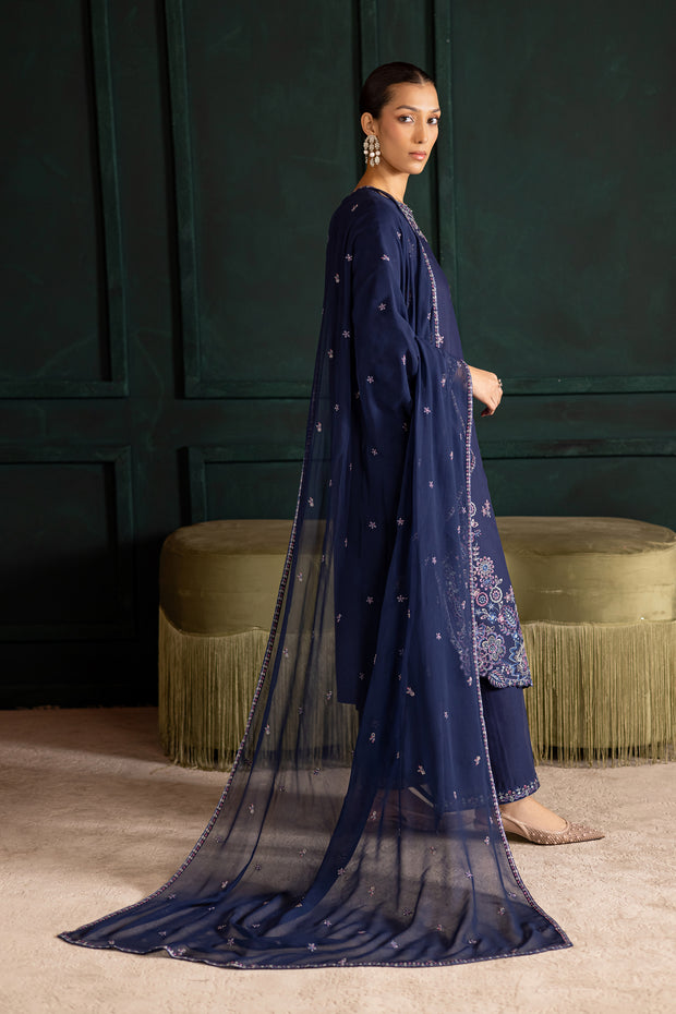 Side view of Dusky embroidered khaddar outfit featuring sleek matching trousers. Ready to wear Pakistani South Asian fashion navy blue
