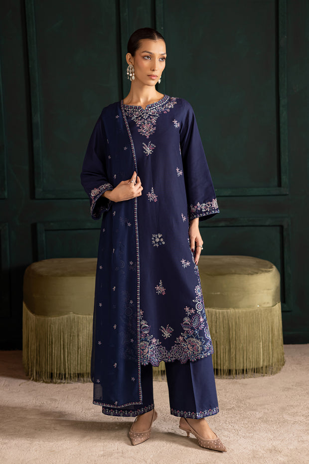 Full length image of Dusky three piece ensemble highlighting elegant embroidery and graceful silhouette. Ready to wear Pakistani South Asian fashion.
