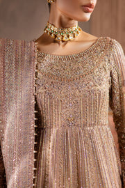 Close-up of bridal neckline detail pink powder pink light pink and sleeves with heavy adda embellishments and delicate beadwork, reflecting fine craftsmanship. Bridal luxury Pakistani South Asian Indian.