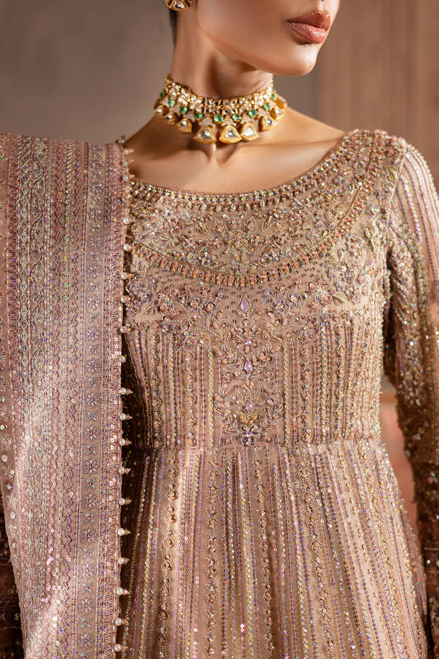 Close-up of bridal neckline detail pink powder pink light pink and sleeves with heavy adda embellishments and delicate beadwork, reflecting fine craftsmanship. Bridal luxury Pakistani South Asian Indian.