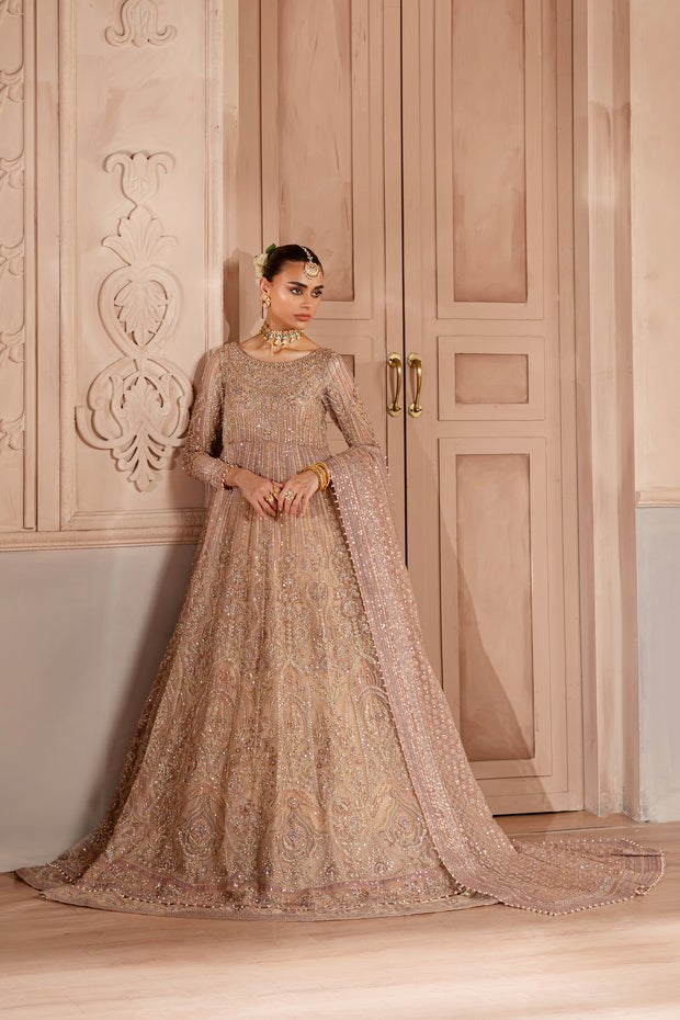Bridal portrait showcasing soft makeup and statement jewelry, paired with detailed hand-embroidered fabric for a refined look. Bridal luxury Pakistani South Asian Indian.