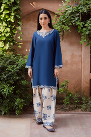 Two piece khaddar set featuring a short blue straight shirt with embroidered keyhole neckline and scalloped borders. Ready to wear Pakistani South Asian.