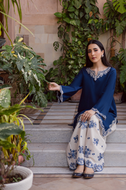 Khaddar outfit designed with flared sleeves, keyhole neckline, and refined embroidery for an elegant modern look. Ready to wear Pakistani South Asian.
