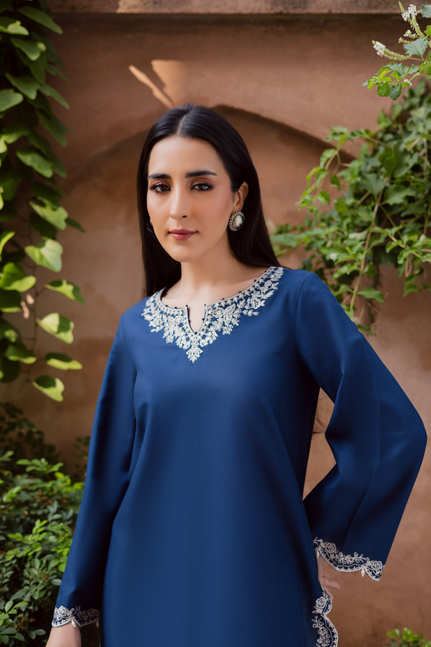 Embroidered blue khaddar shirt with delicate pearl hangings and scalloped finish at the hem and sleeves