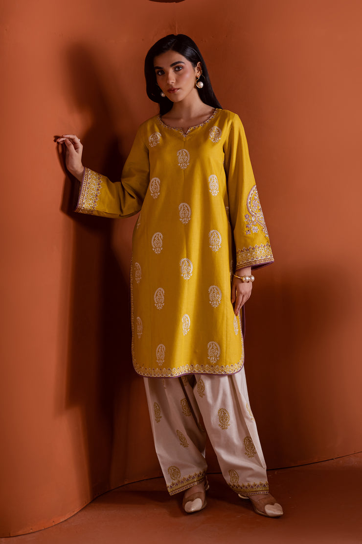 Two piece khaddar ensemble in lime and beige showcasing intricate white thread embroidery. Ready to wear Pakistani South Asian