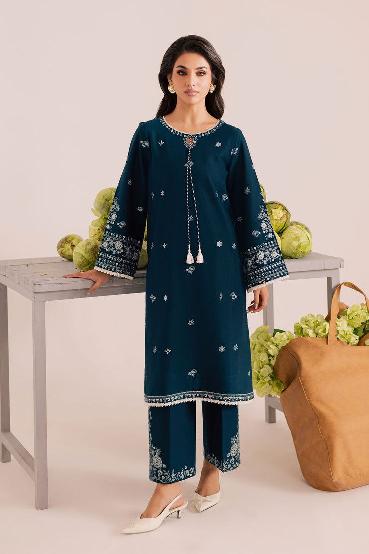 affordable Twilight Sea two piece khaddar set in ocean blue featuring a keyhole neckline with tassel detail and lace finishing. Ready to wear Pakistani South Asian.