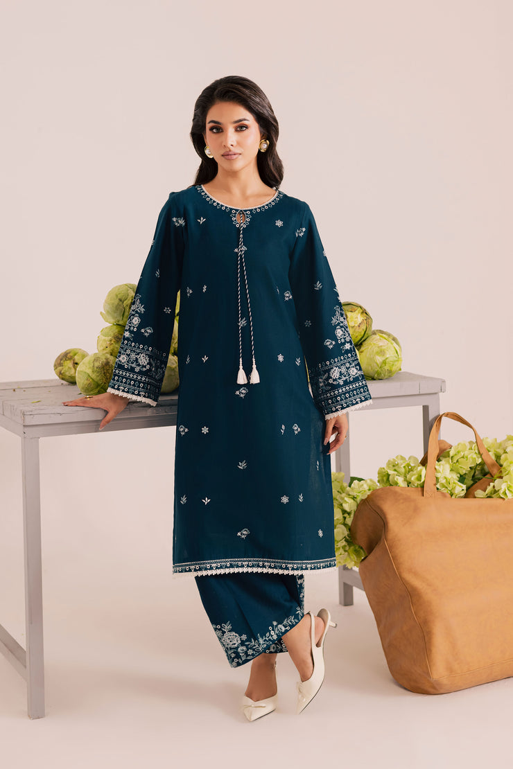 Embroidered blue khaddar outfit with lace finished hem and matching culottes for a modern classic look. Ready to wear Pakistani South Asian.