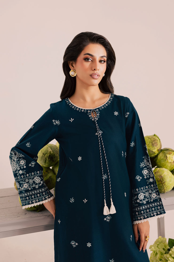 Ocean blue khaddar shirt adorned with all over embroidery and delicate boring work for refined elegance. Ready to wear Pakistani South Asian